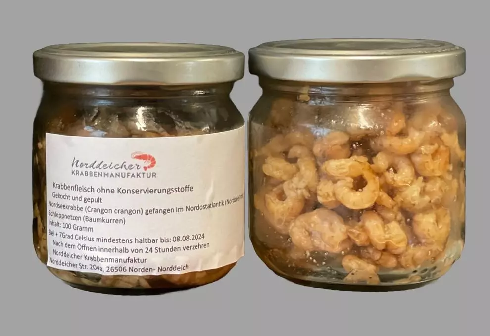 Gekochtes und gepultes Krabbenfleisch im Glas, Etikett sicht